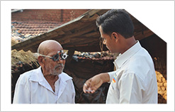 Programme Highlights: MFV field team checking a patient's visual acuity during Community Impact Assessment study