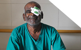 Patient smiling & happy after undergoing eye surgery